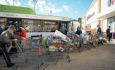 Organizers bring shopping carts full of toys to a CTfastrak bus as donations.